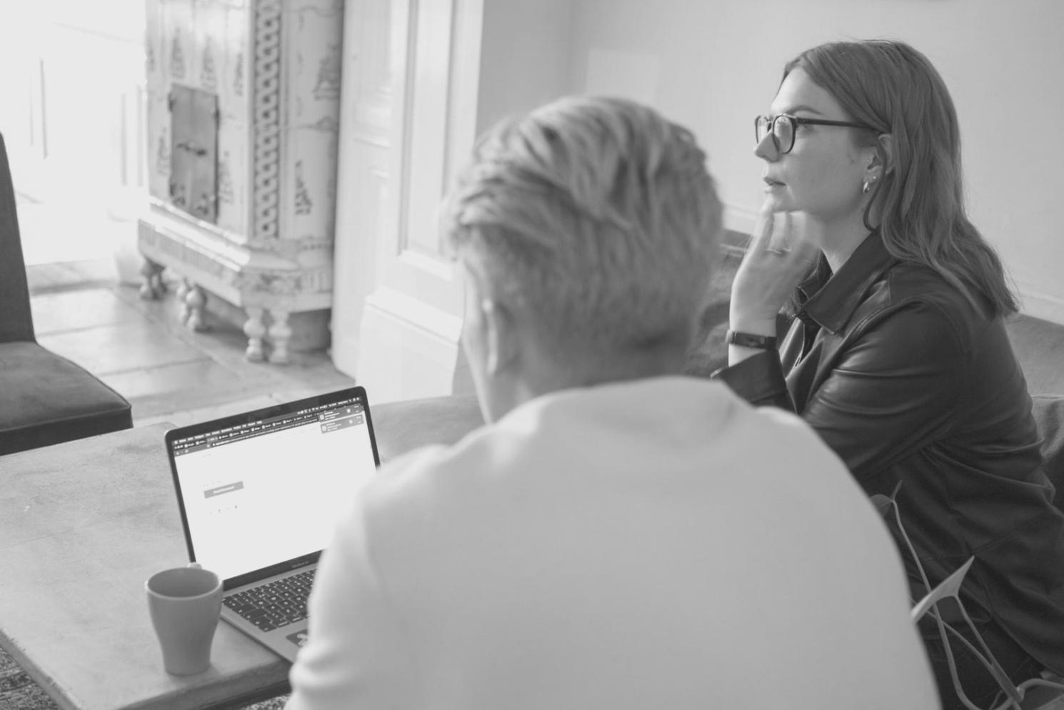 Collaborative workspace showing financial planning session with seasonal budget charts and analysis materials